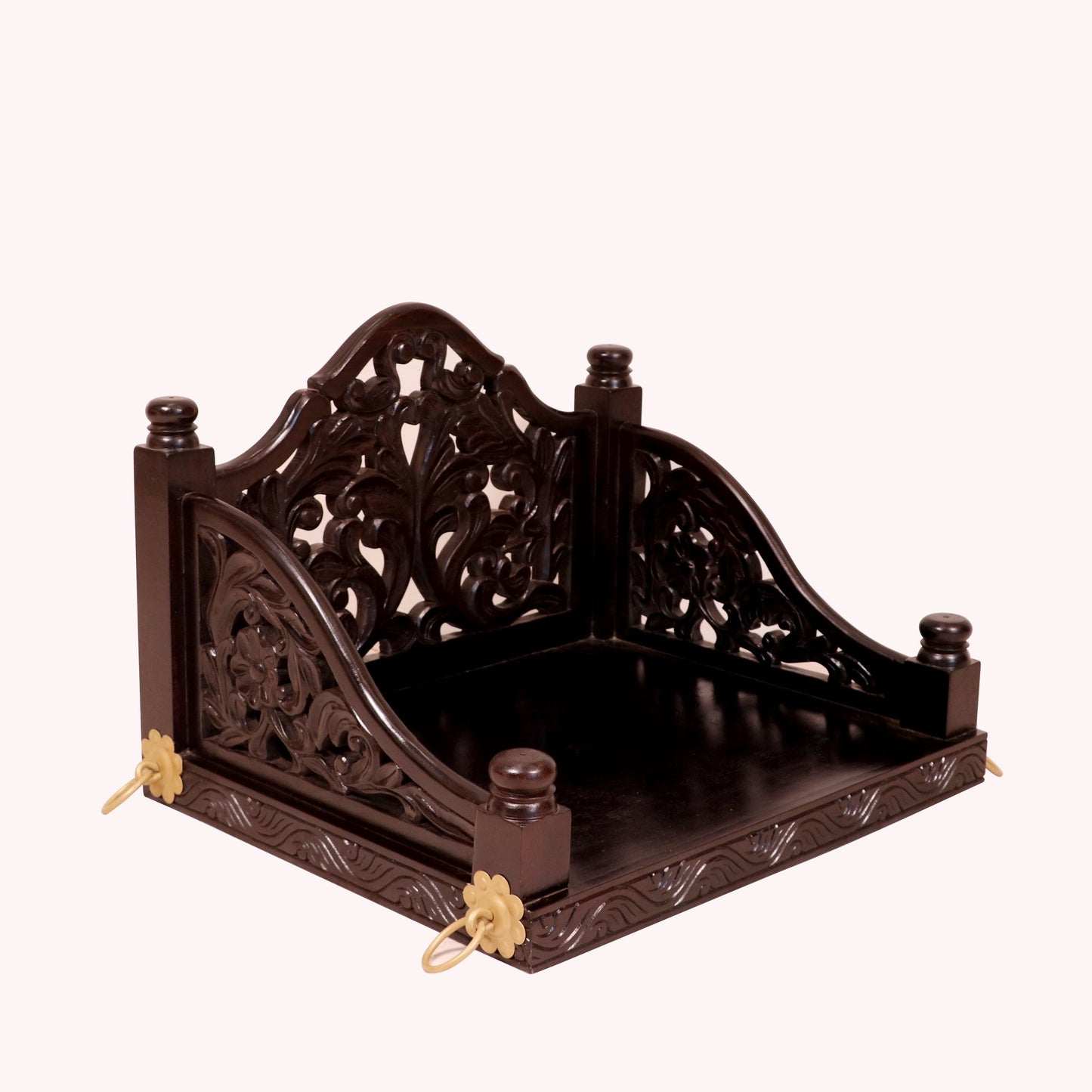 Handcrafted carved detailing on dark tone wooden swing