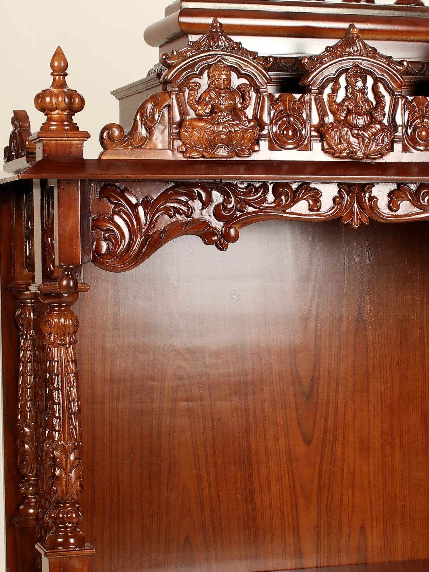 Traditional Indian wooden temple with deity carvings