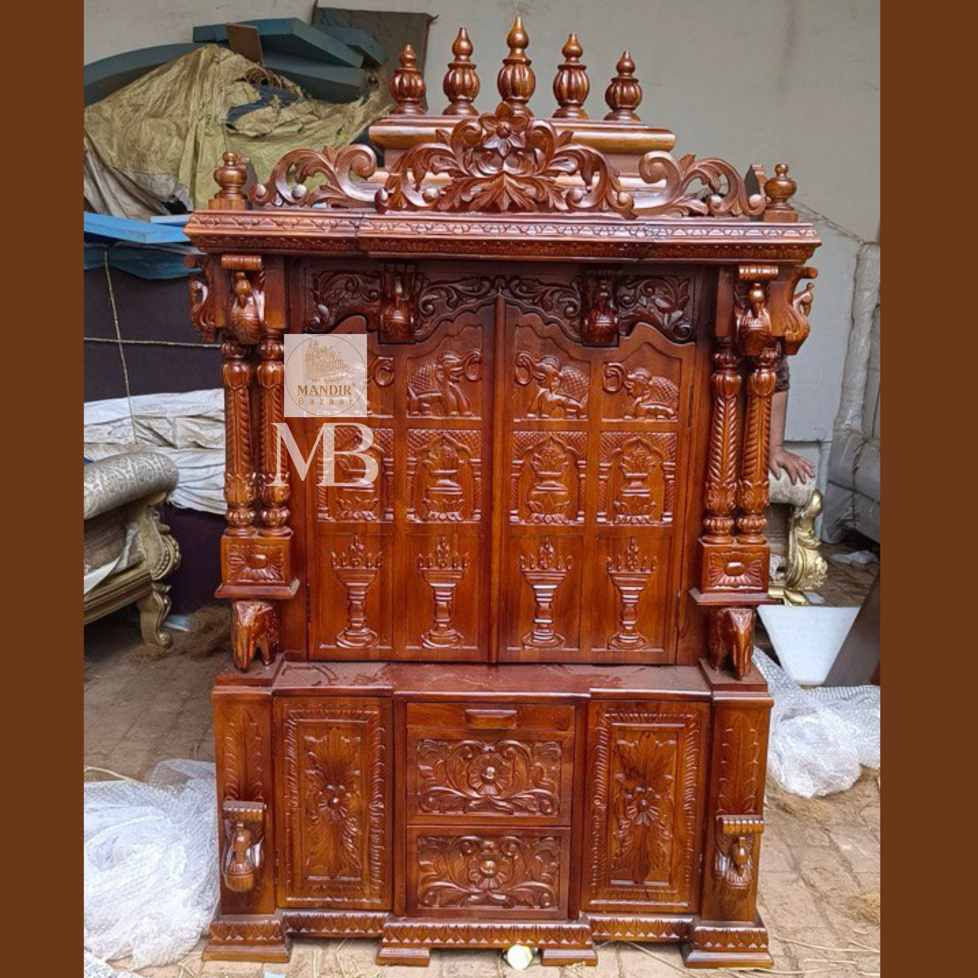 6 feet hand carved wooden pooja mandir with traditional floral carvings, elephant motifs, carved doors and storage drawers for home
