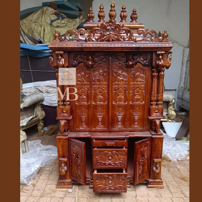 6 feet hand carved wooden pooja mandir with traditional floral carvings, elephant motifs, carved doors and storage drawers for home