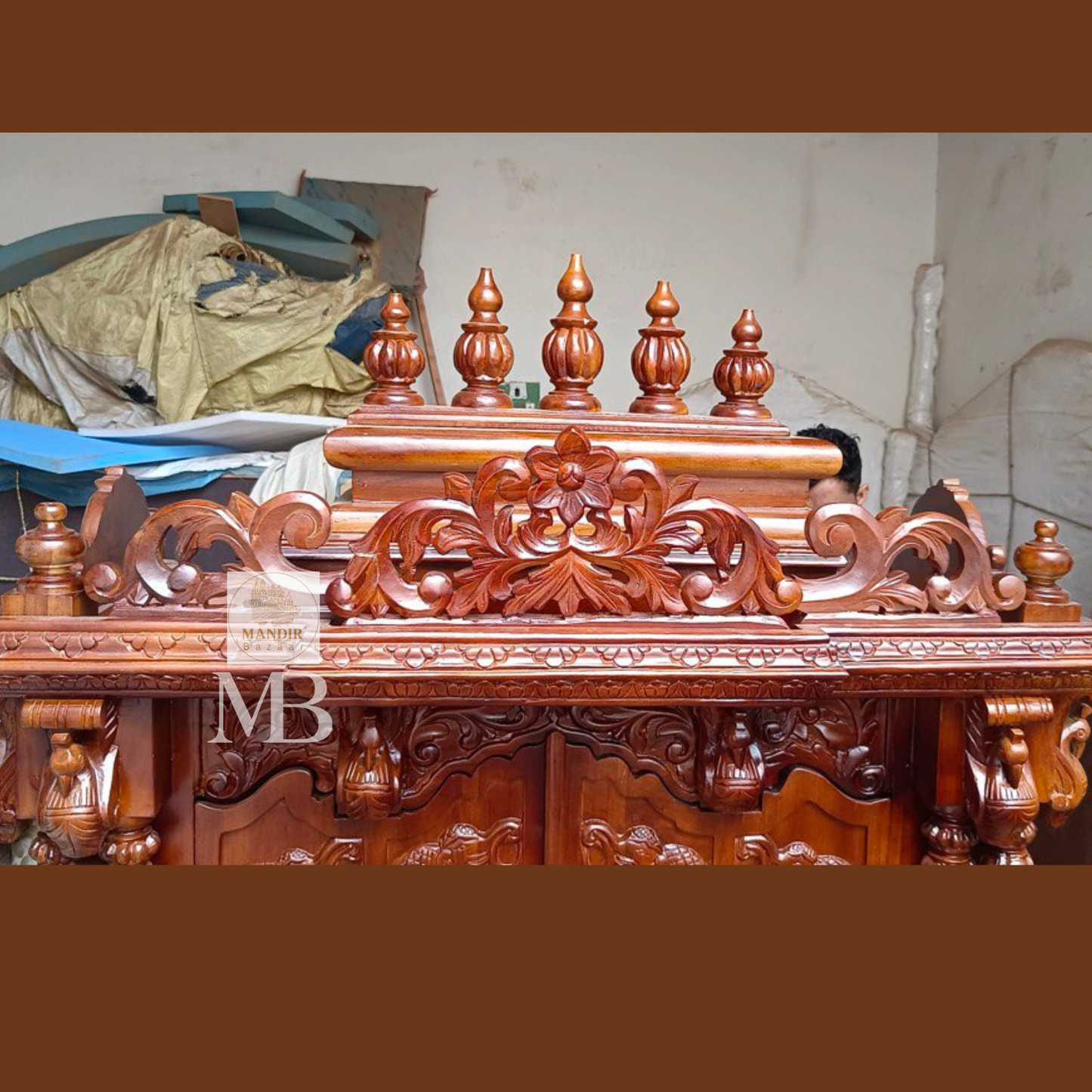 6 feet hand carved wooden pooja mandir with traditional floral carvings, elephant motifs, carved doors and storage drawers for home