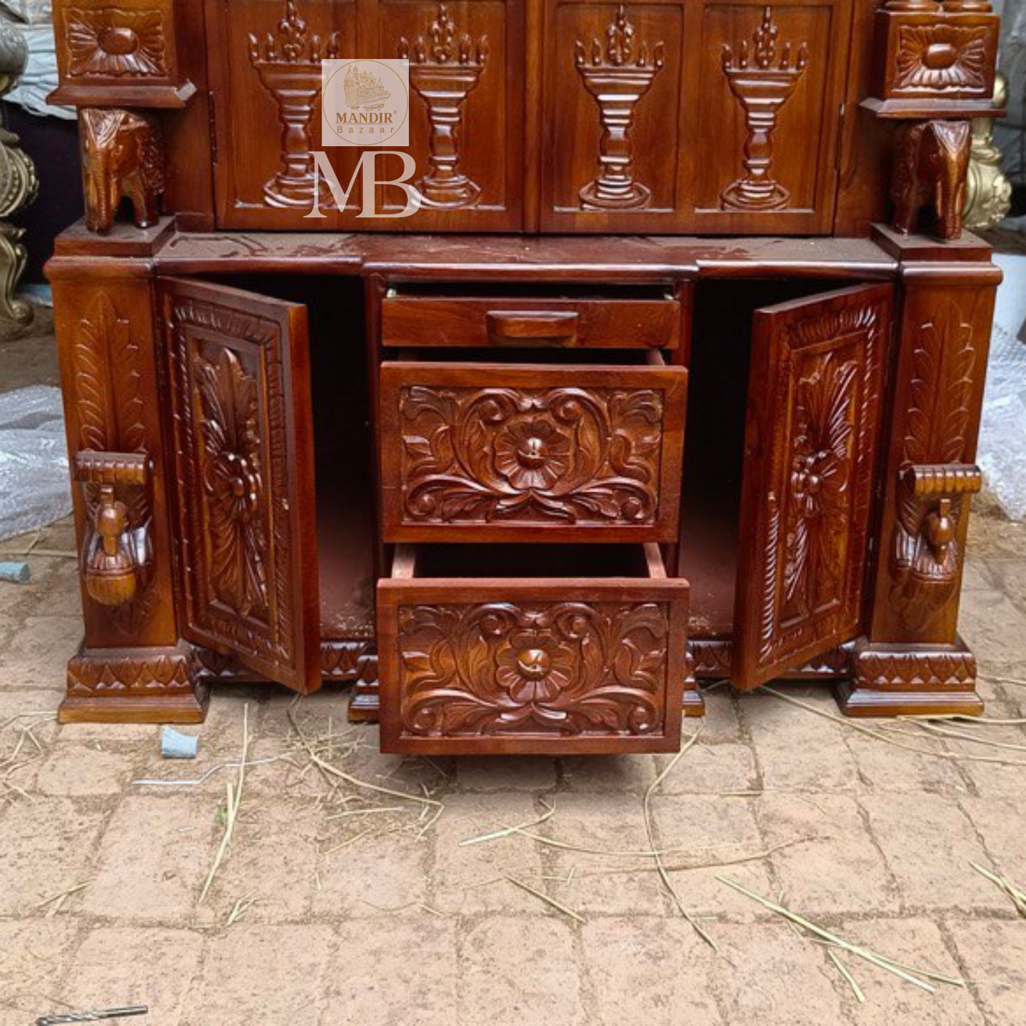 6 feet hand carved wooden pooja mandir with traditional floral carvings, elephant motifs, carved doors and storage drawers for home