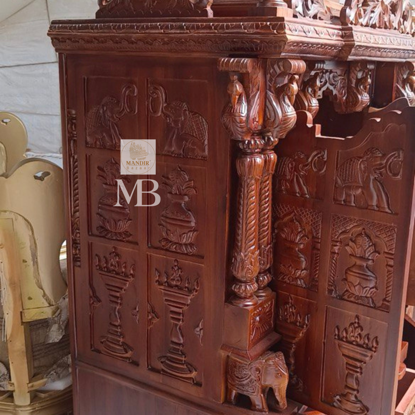 6 feet hand carved wooden pooja mandir with traditional floral carvings, elephant motifs, carved doors and storage drawers for home