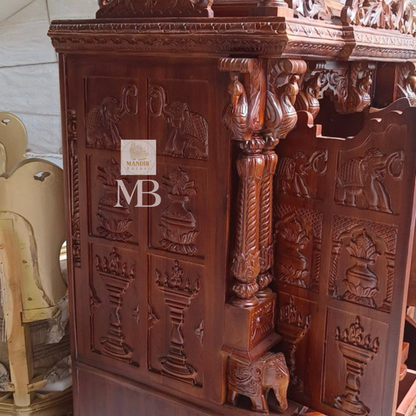 6 feet hand carved wooden pooja mandir with traditional floral carvings, elephant motifs, carved doors and storage drawers for home