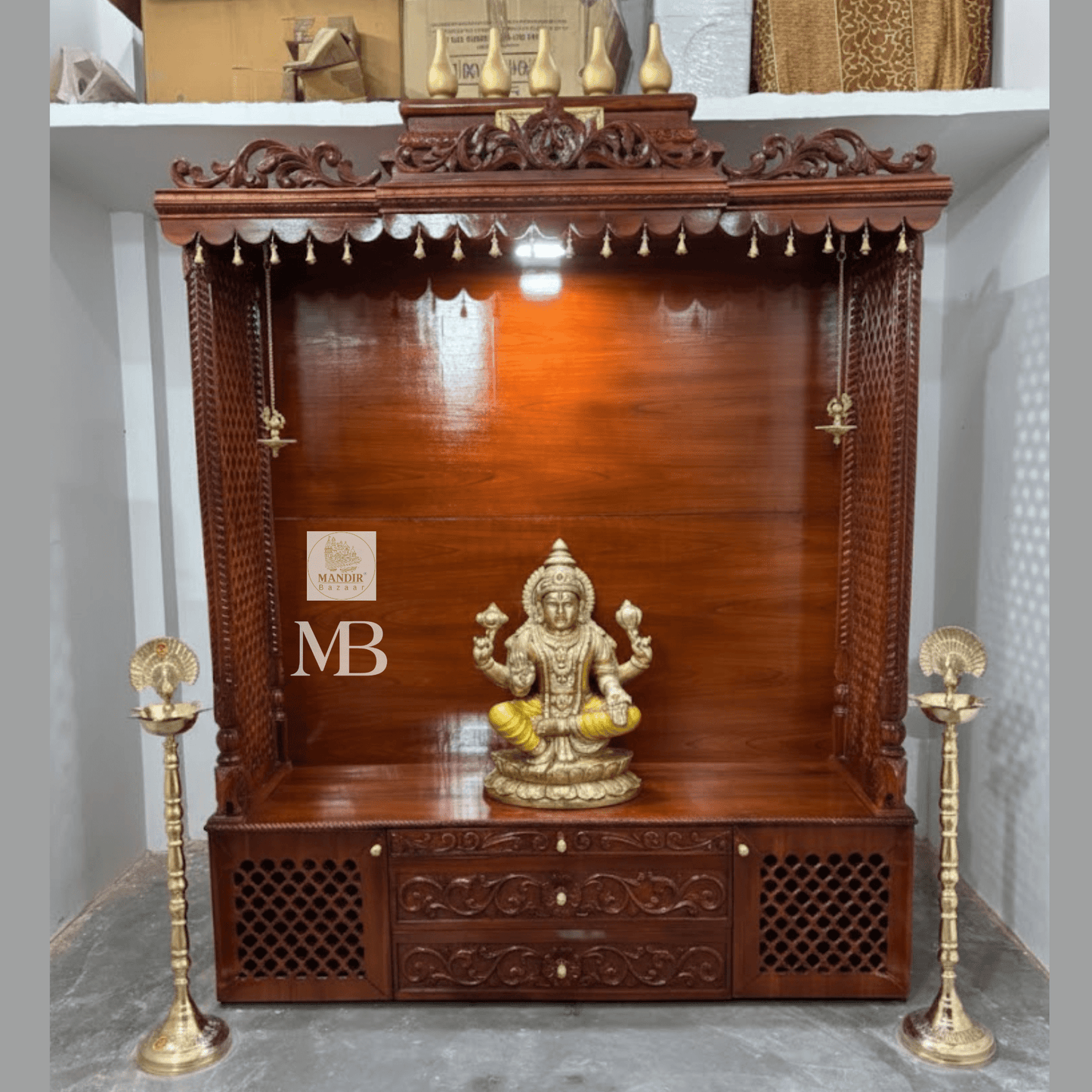 7 feet hand carved wooden pooja mandir with traditional crown, jaali carvings, storage drawers and brass diyas
