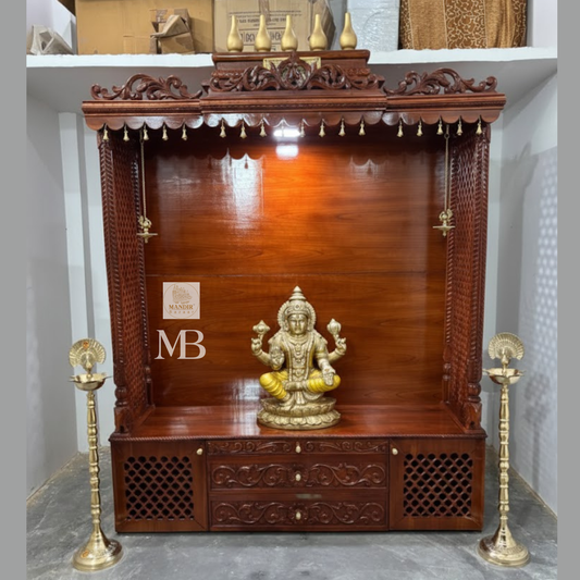 7 feet hand carved wooden pooja mandir with traditional crown, jaali carvings, storage drawers and brass diyas