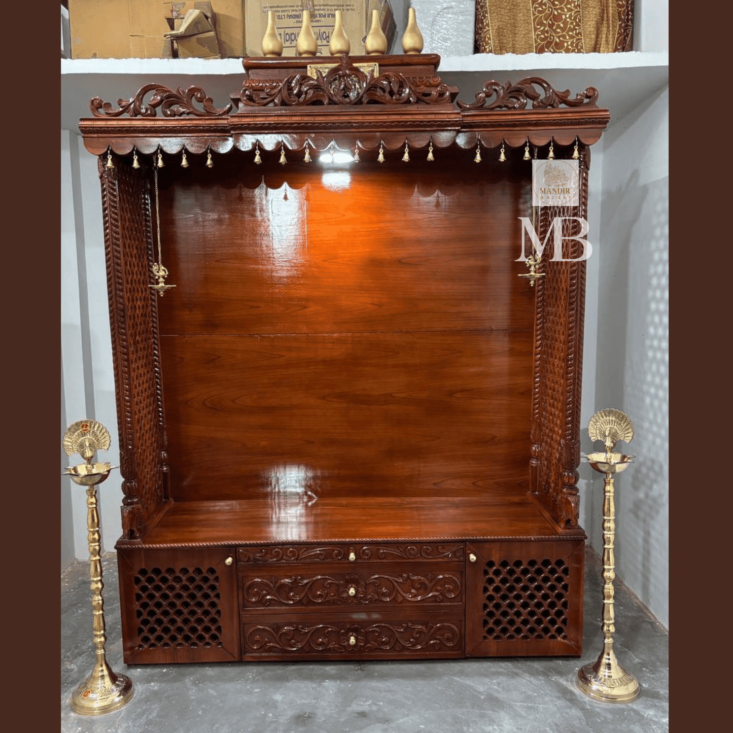 7 feet hand carved wooden pooja mandir with traditional crown, jaali carvings, storage drawers and brass diyas