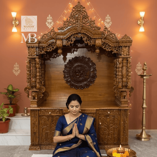 Detailed wooden pillars and decorative carvings on traditional pooja mandir
