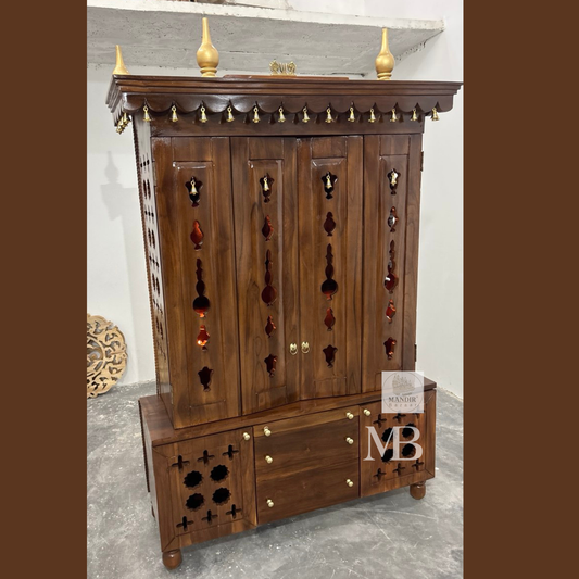 Teak wood home temple with traditional carved canopy and decorative brass hanging bells