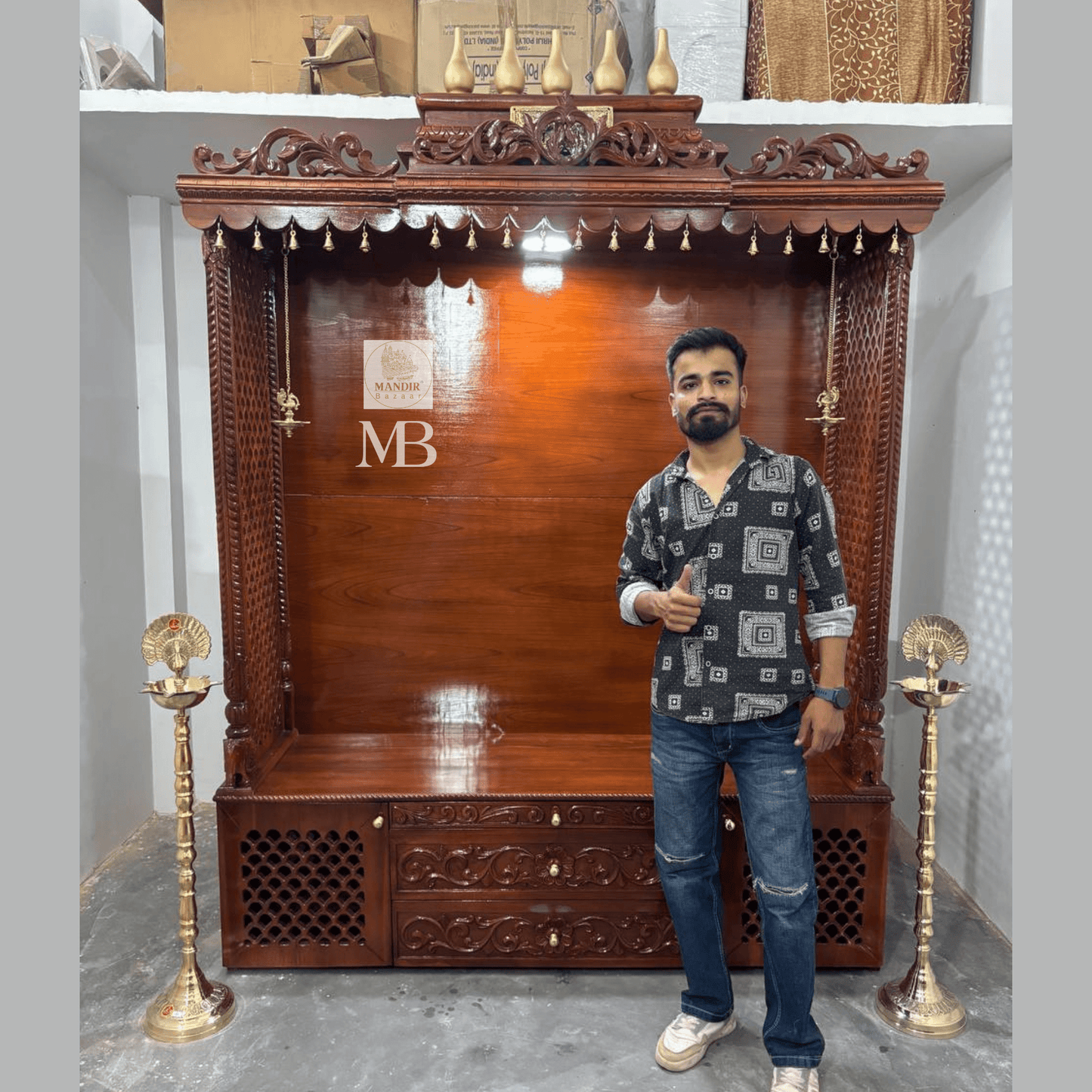 7 feet hand carved wooden pooja mandir with traditional crown, jaali carvings, storage drawers and brass diyas