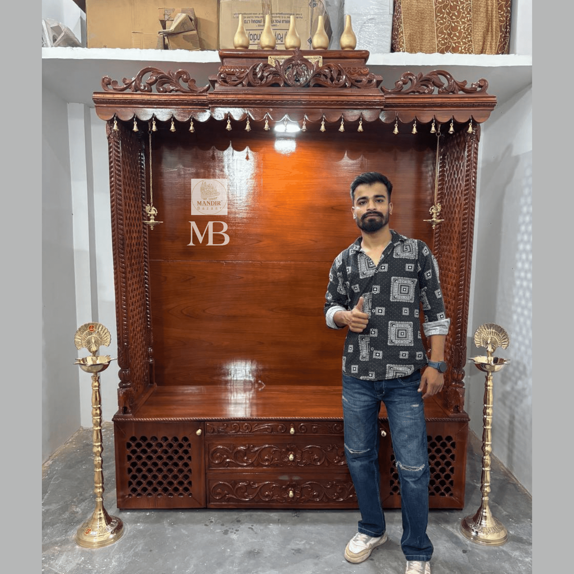 7 feet hand carved wooden pooja mandir with traditional crown, jaali carvings, storage drawers and brass diyas