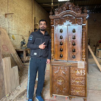 Luxury handcrafted solid teak wood pooja mandir with brass bells, carved pillars, storage cabinet, three drawers, walnut brown finish, traditional Hindu temple for home by Mandir Bazaar.