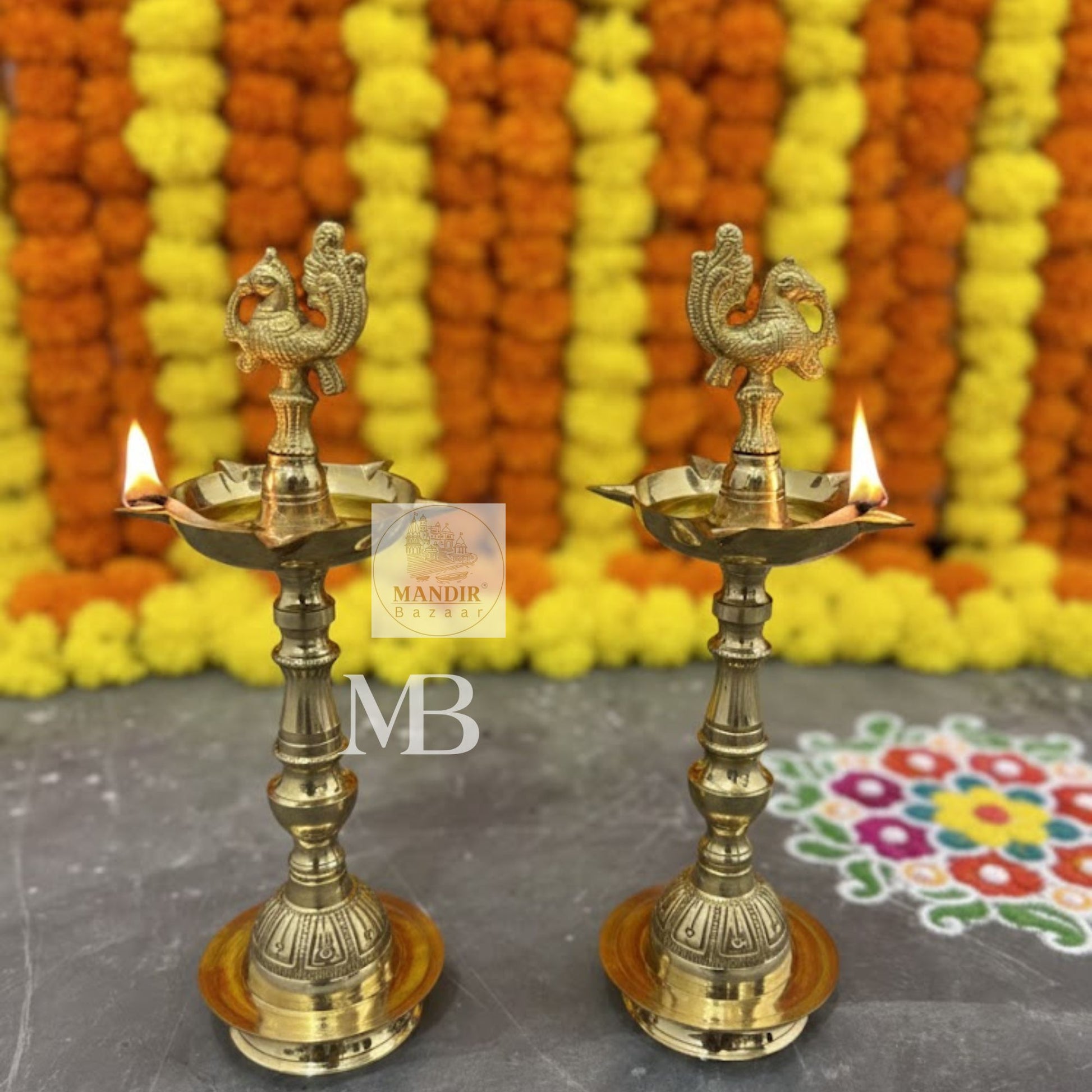 Traditional brass oil lamps with peacock design for pooja