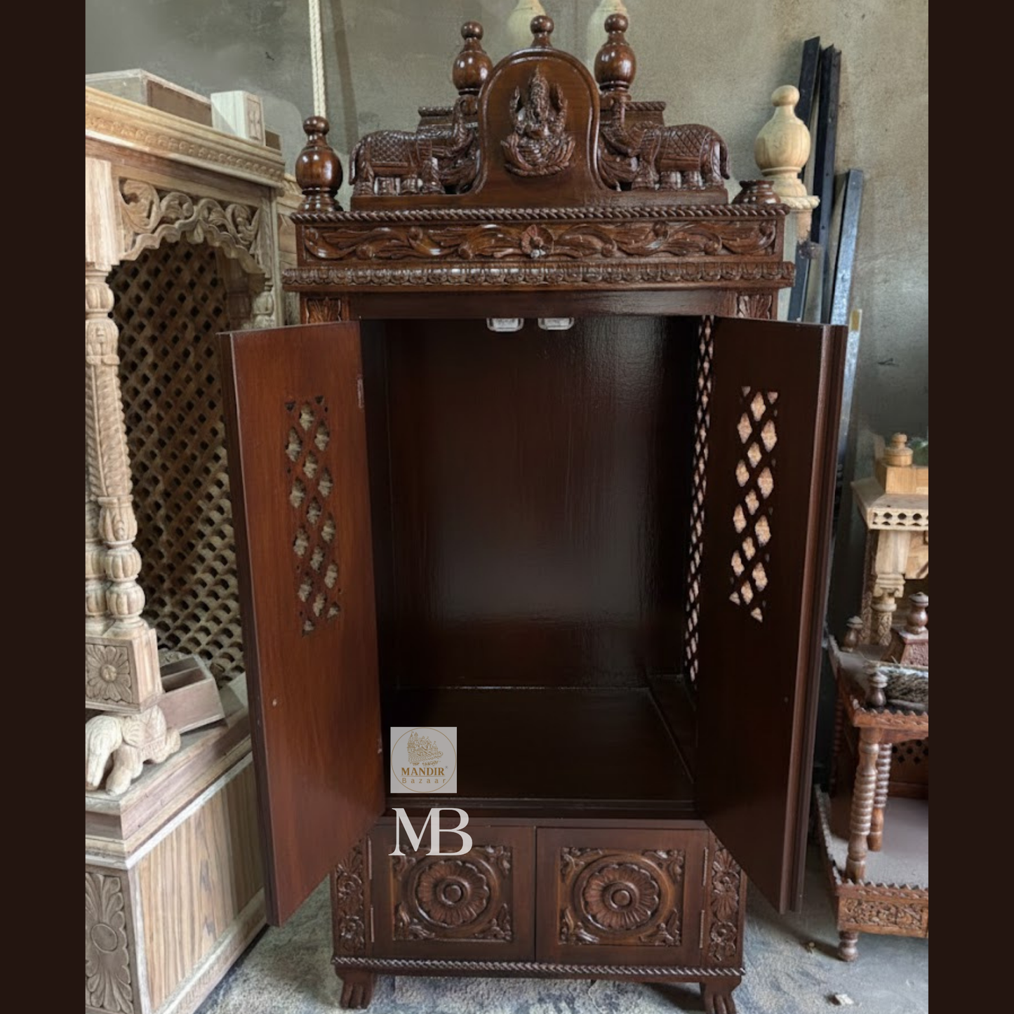 Dark brown wooden mandir for home with traditional carved temple design