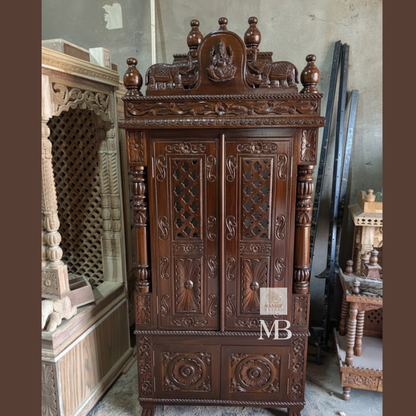 Hand carved dark wood pooja mandir with intricate floral detailing