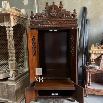 Traditional dark brown wooden temple with ornate carved crown