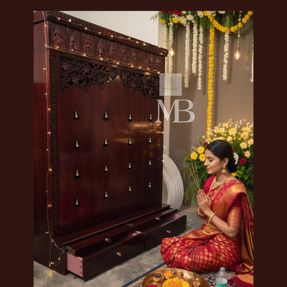 Dark brown wooden pooja mandir with carved floral panels, brass bell accents and spacious storage drawers