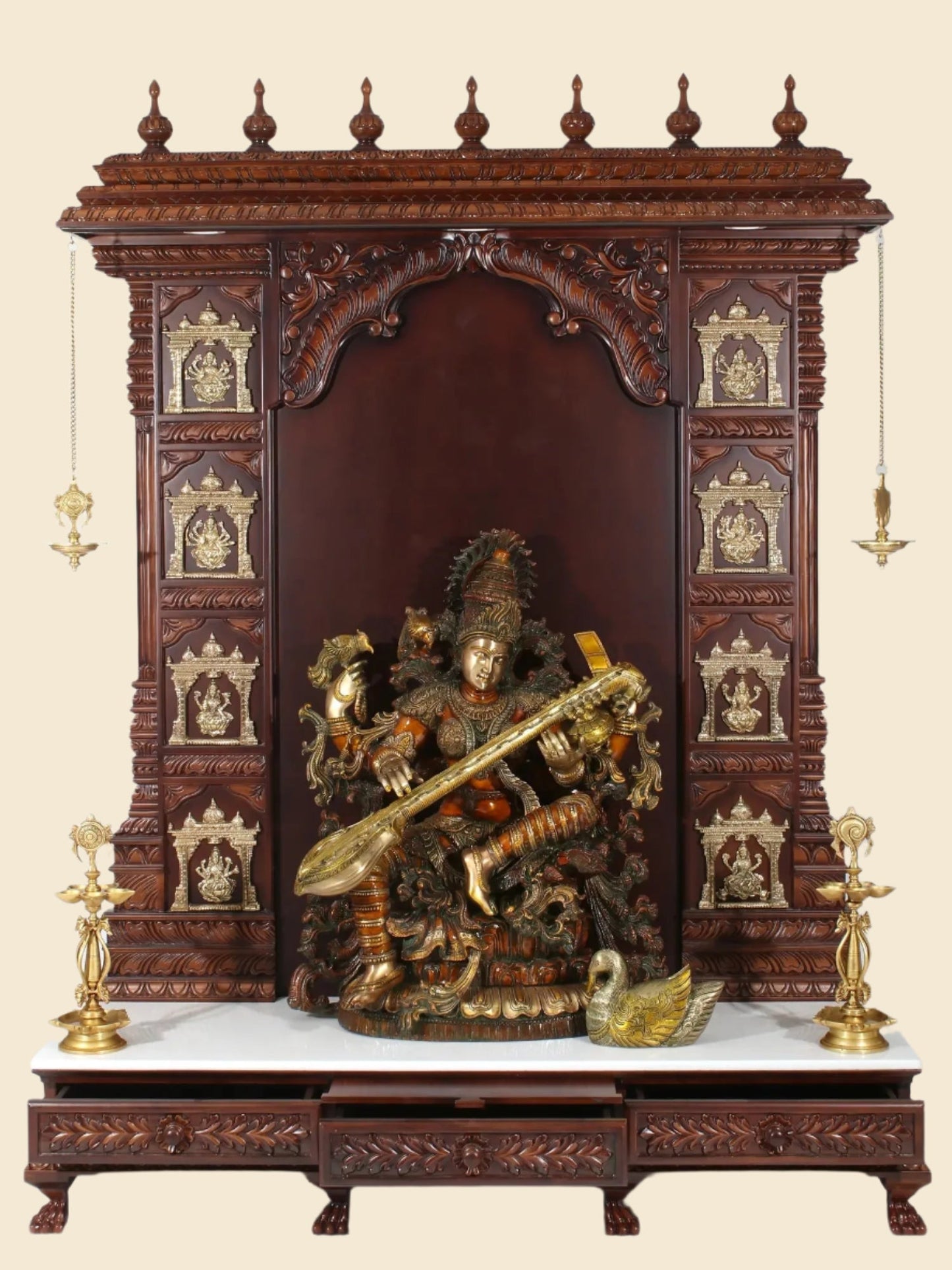 Handcrafted wooden and marble Hindu temple with brass lamps