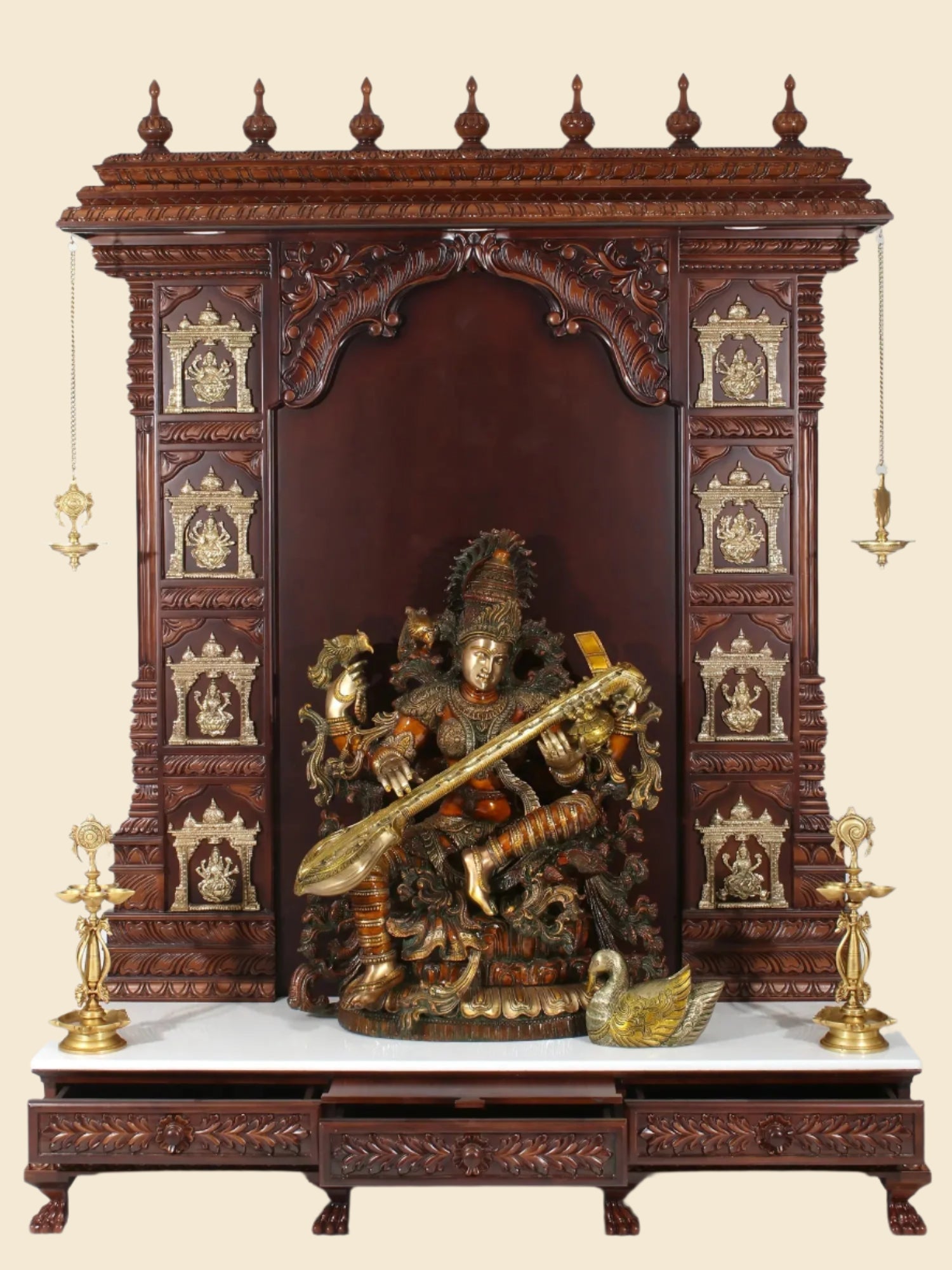 Handcrafted wooden and marble Hindu temple with brass lamps