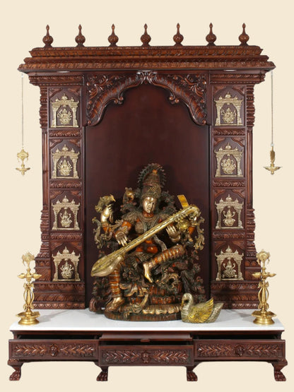 Handcrafted wooden and marble Hindu temple with brass lamps