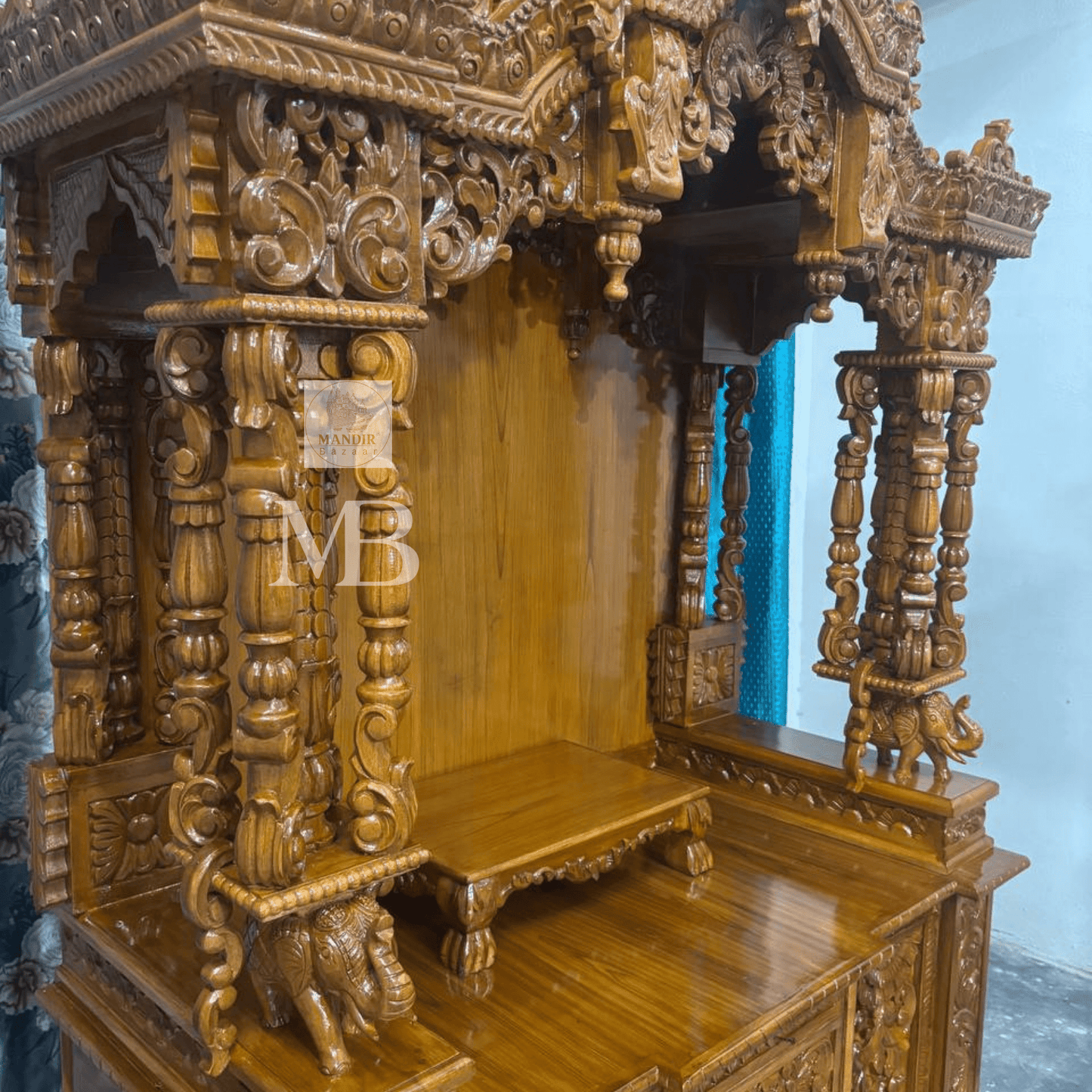 Hand carved wooden temple pillars with traditional ornamental detailing