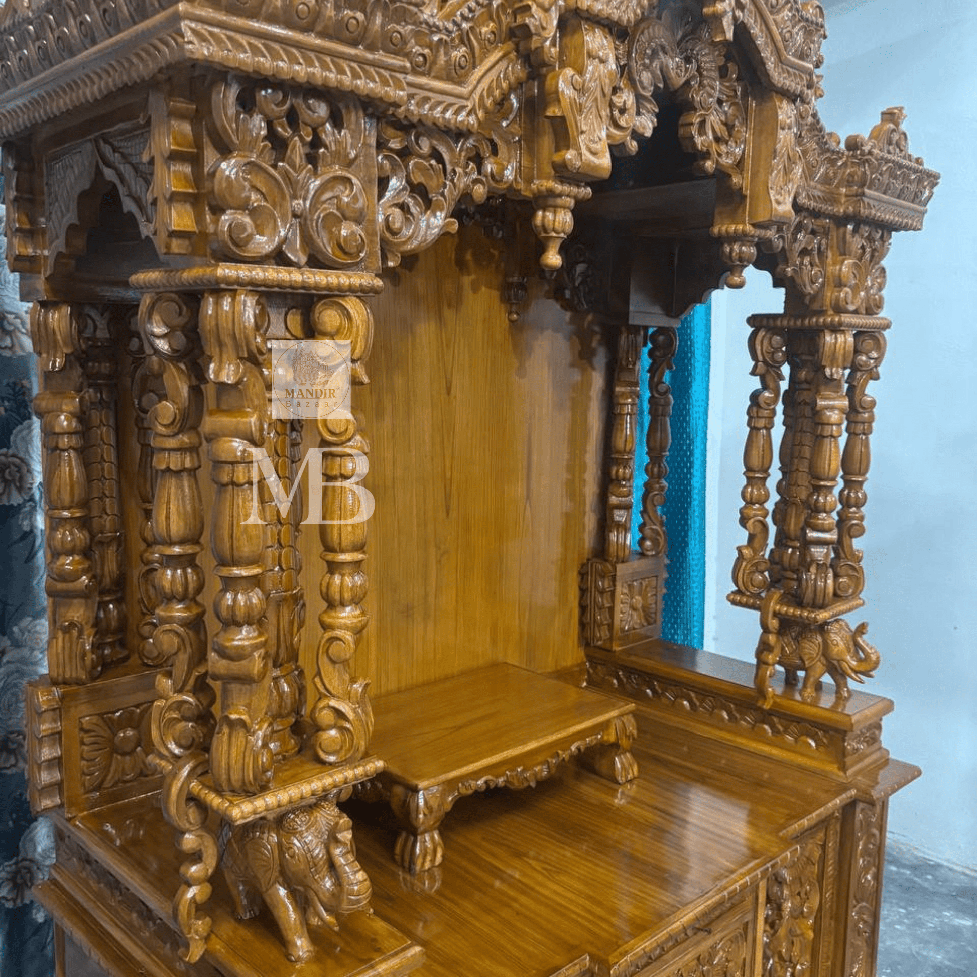 Hand carved wooden temple pillars with traditional ornamental detailing