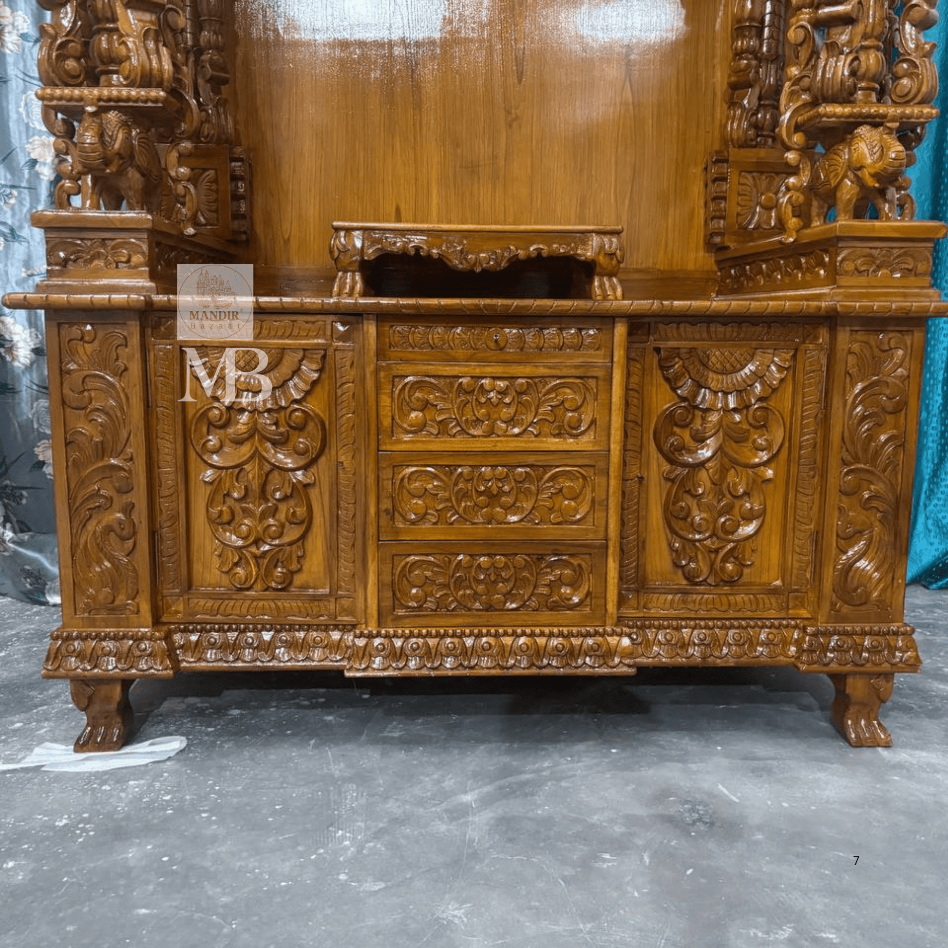 Intricate carved wooden mandir crown with traditional floral detailing