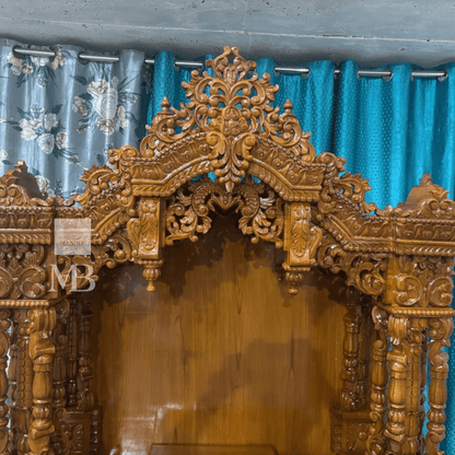 Intricate carved wooden mandir crown with traditional floral detailing