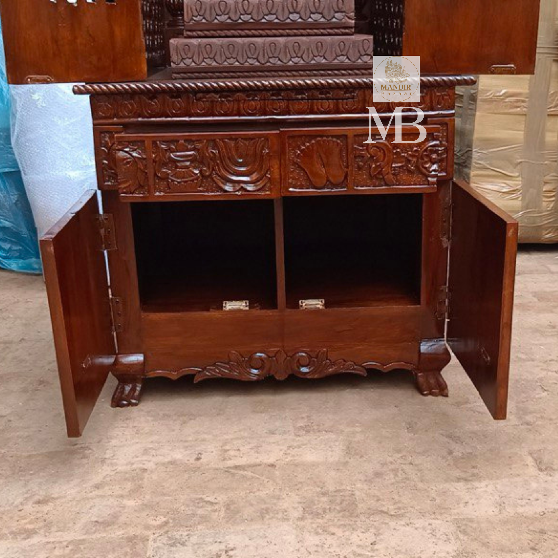 Hand carved wooden mandir for home with enclosed doors and storage cabinet