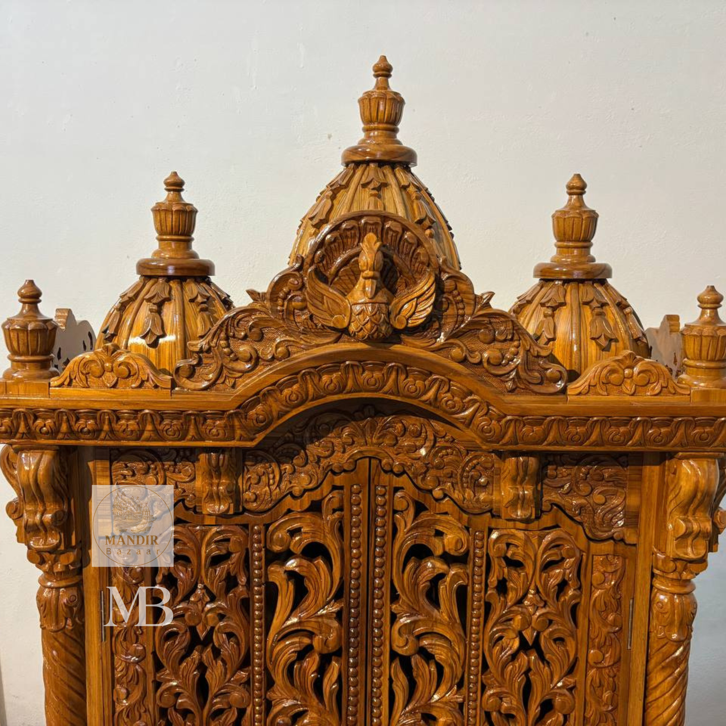 Hand carved wooden mandir for home with traditional shikhar and storage cabinet