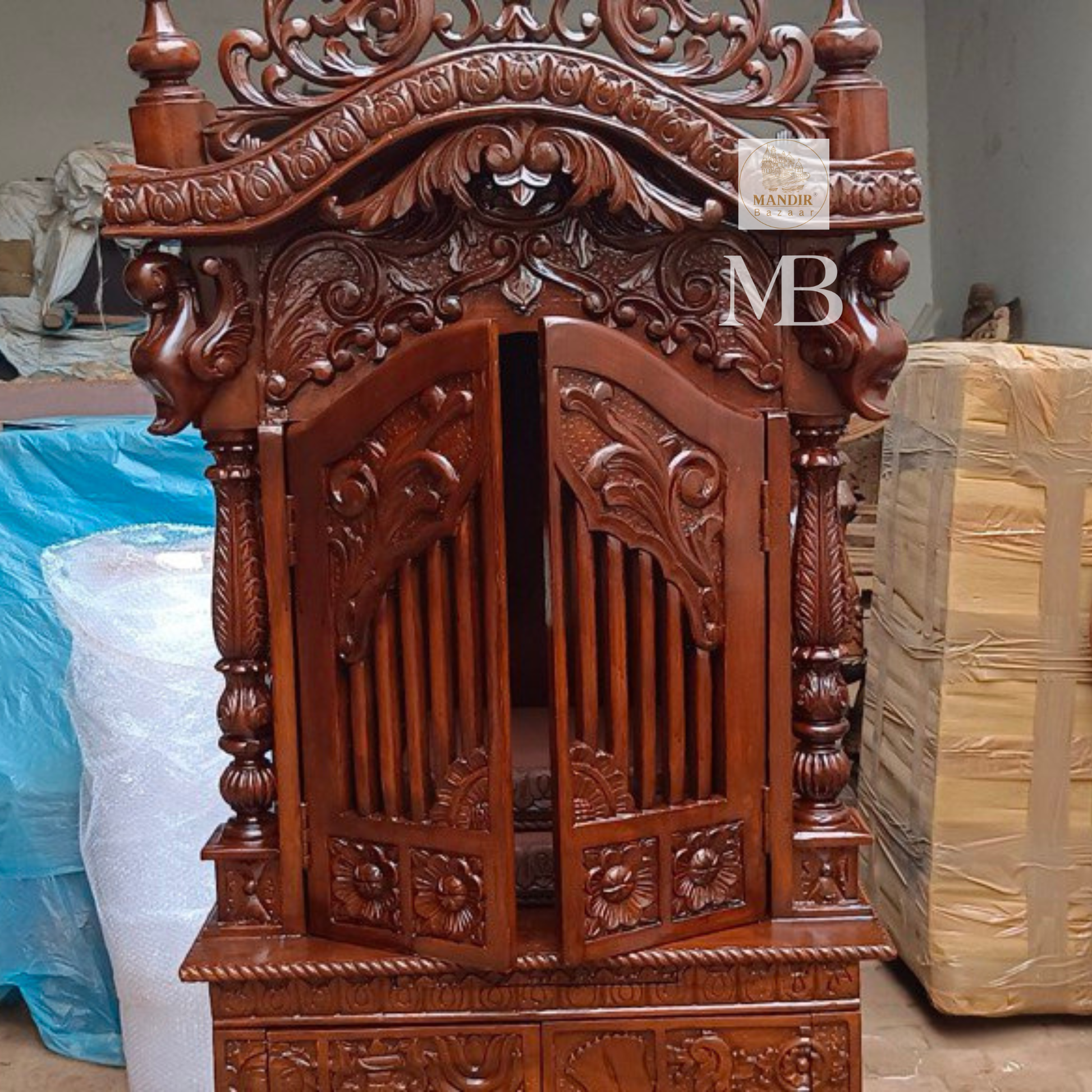 Hand carved wooden mandir for home with enclosed doors and storage cabinet