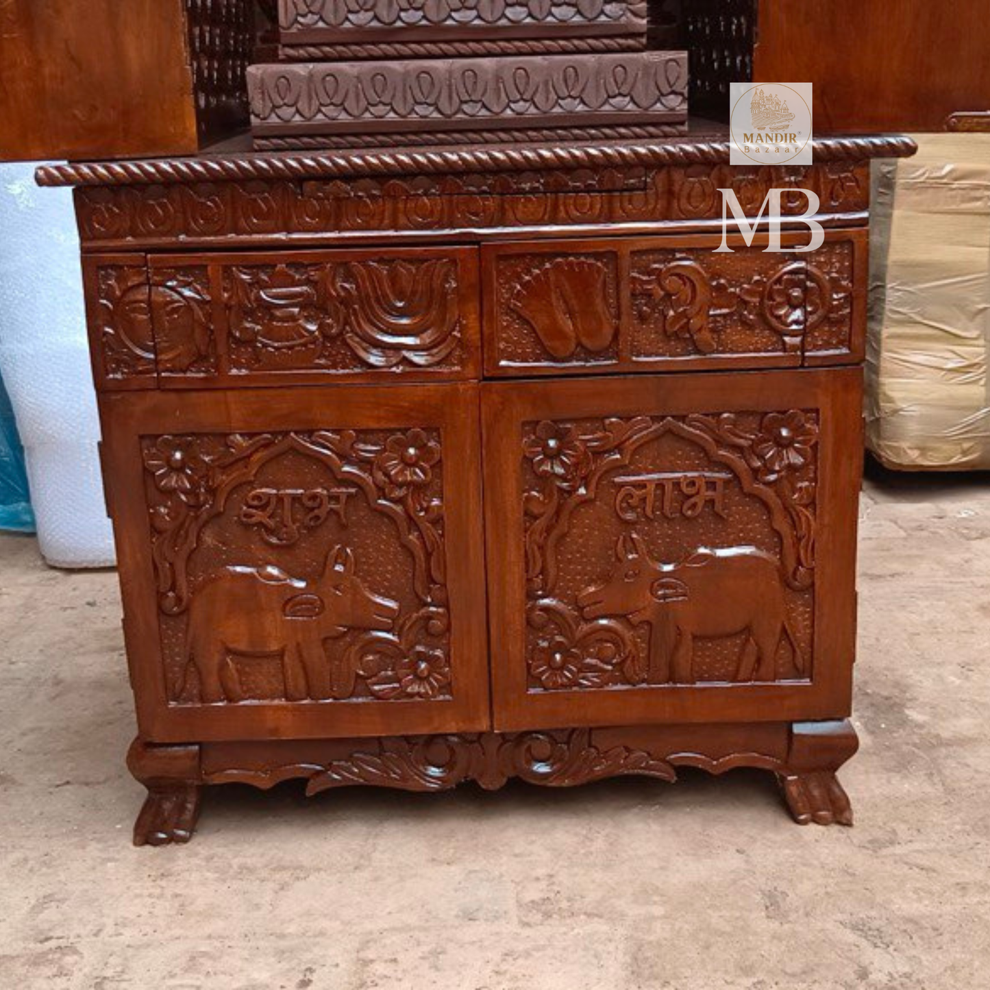 Hand carved wooden mandir for home with enclosed doors and storage cabinet