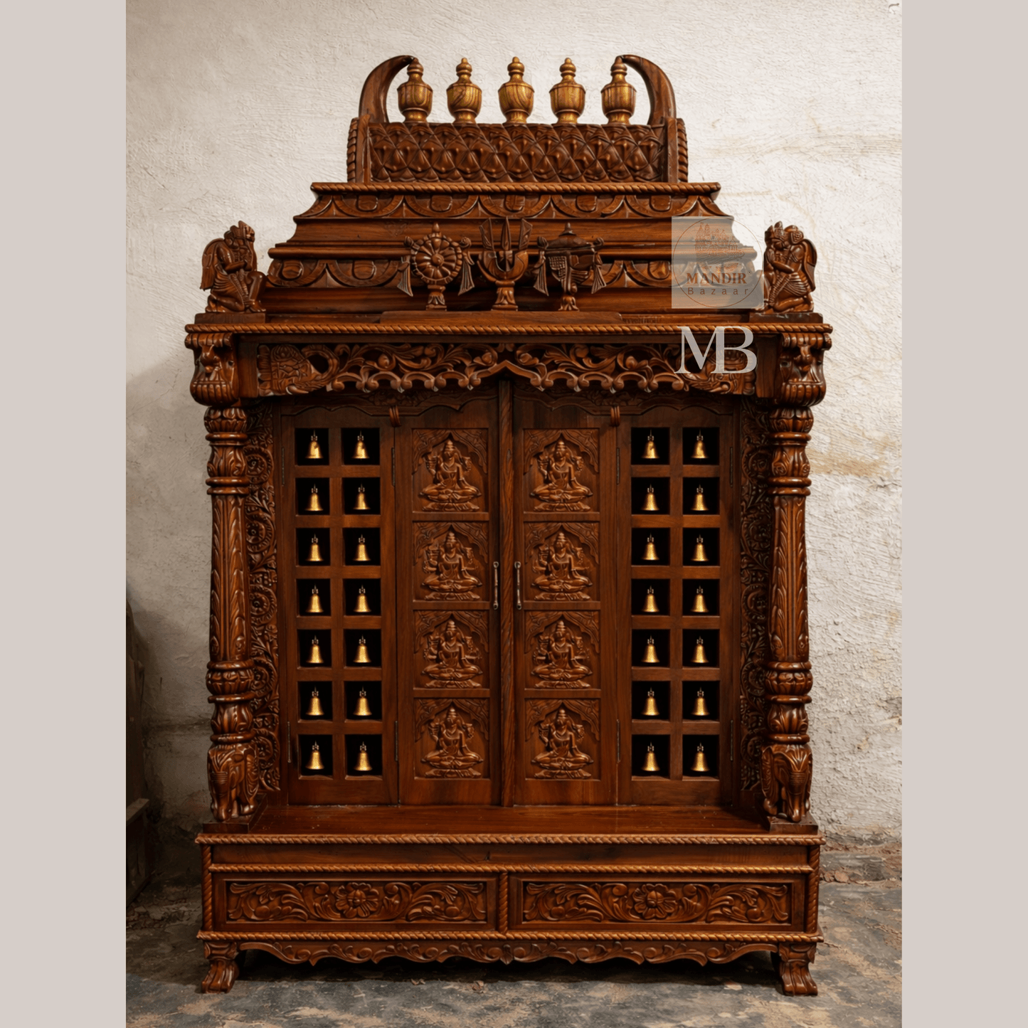 6 feet hand carved wooden pooja mandir with ornate crown, carved deity doors, decorative bells, pillars and storage drawers