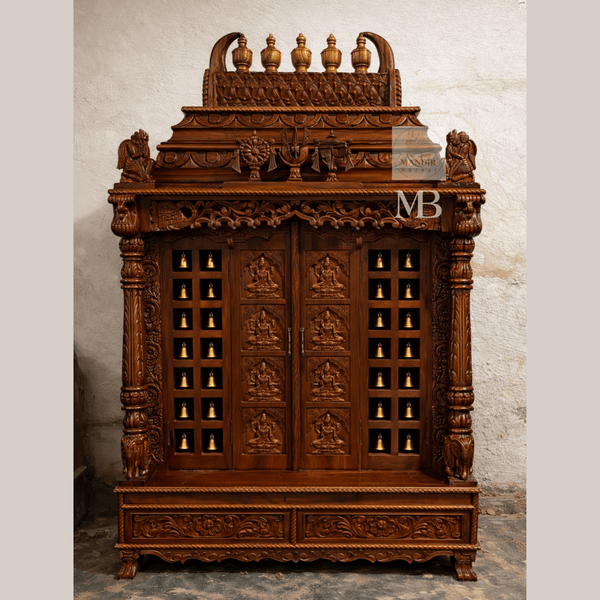 6 feet hand carved wooden pooja mandir with ornate crown, carved deity doors, decorative bells, pillars and storage drawers