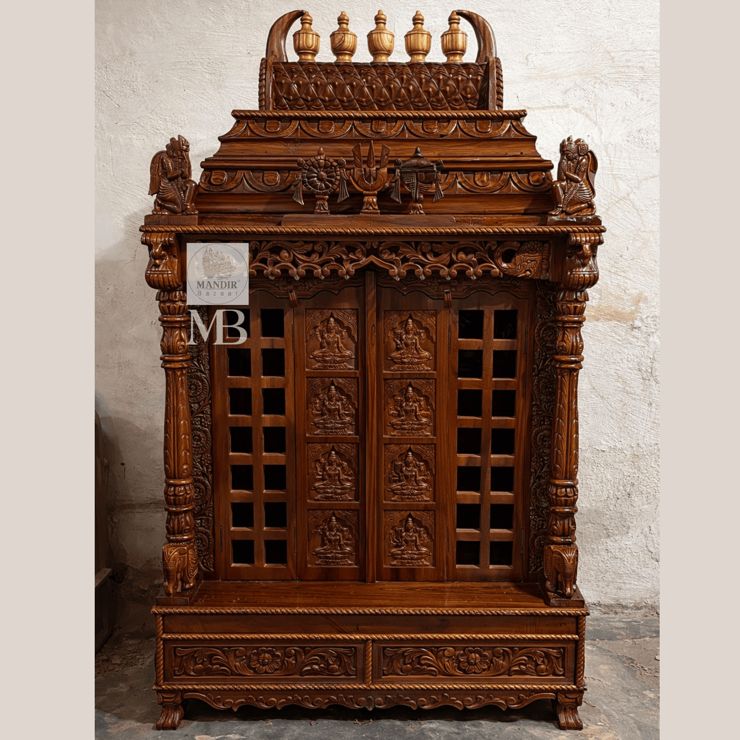 Hand carved wooden pooja mandir doors featuring multiple detailed devotional deity panels