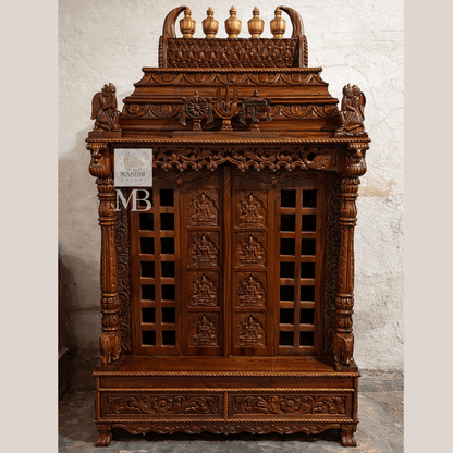 Hand carved wooden pooja mandir doors featuring multiple detailed devotional deity panels