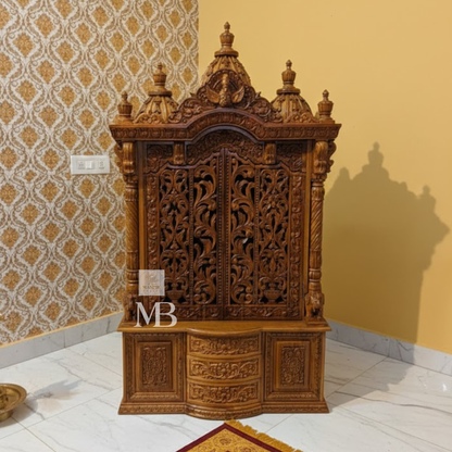 Hand carved wooden mandir for home with traditional shikhar and storage cabinet