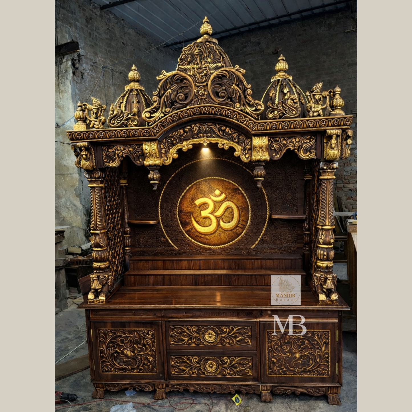 dark brown wooden mandir for home with hand carved Om design, antique gold detailing and storage drawers