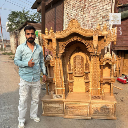 Traditional wooden pooja mandir with intricate floral carvings