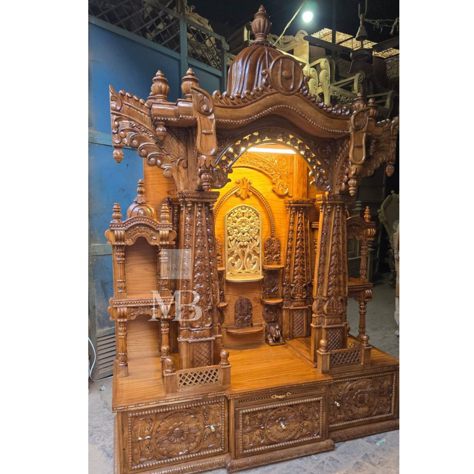 Handcrafted wooden Hindu temple with detailed carved pillars