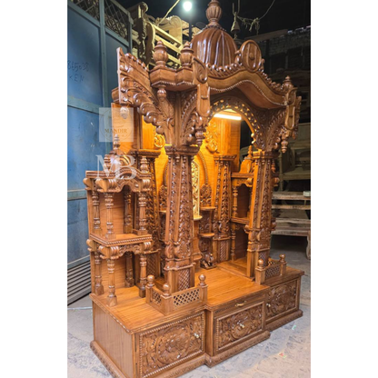 Traditional Indian wooden home temple with decorative arch and carvings