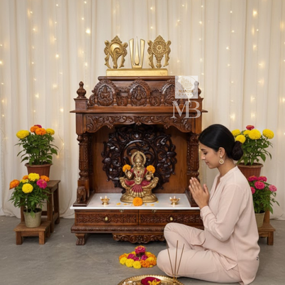 Traditional wooden home temple with carved pillars and decorative deity panels