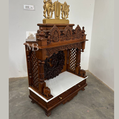 Detailed Om carving on handcrafted wooden Hindu temple