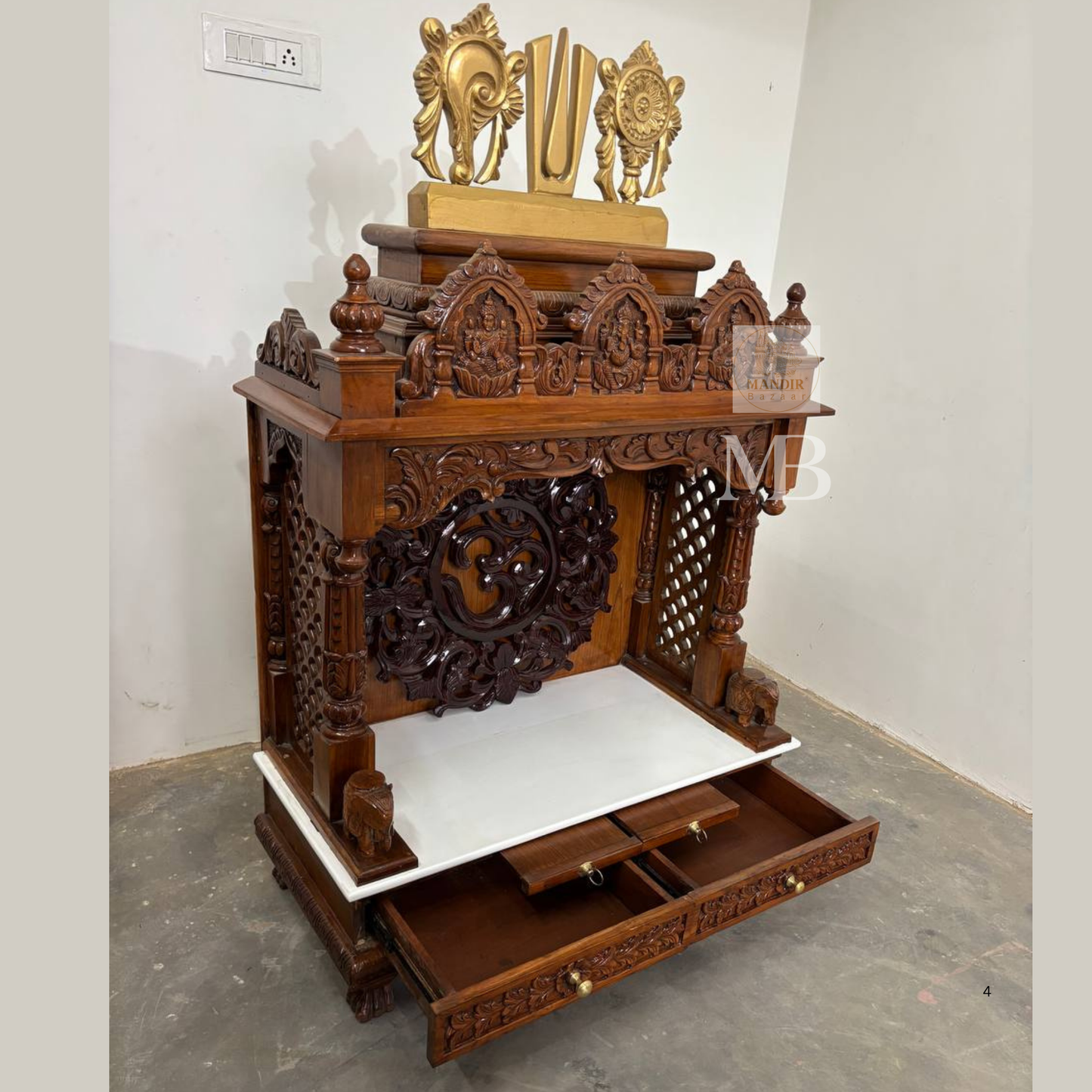 Intricate deity carvings on traditional handcrafted wooden pooja mandir
