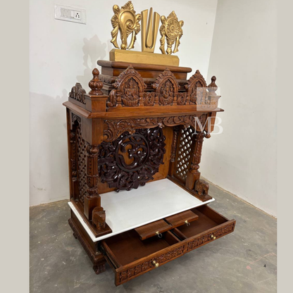 Intricate deity carvings on traditional handcrafted wooden pooja mandir