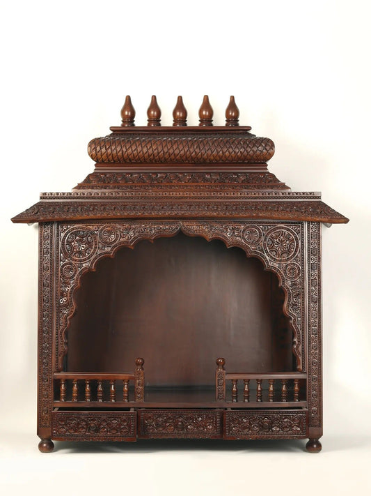 Hand carved wooden pooja mandir with traditional Indian craftsmanship