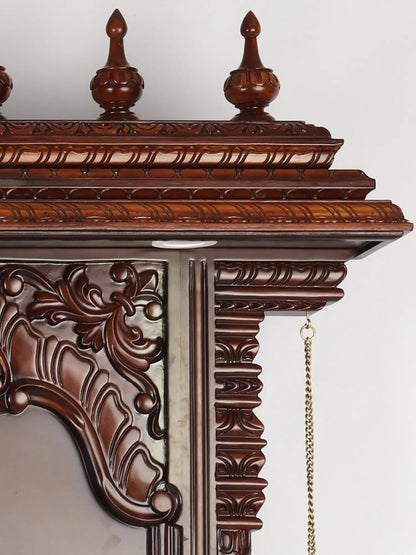 luxury teakwood wooden mandir with brass lamps and marble detailing