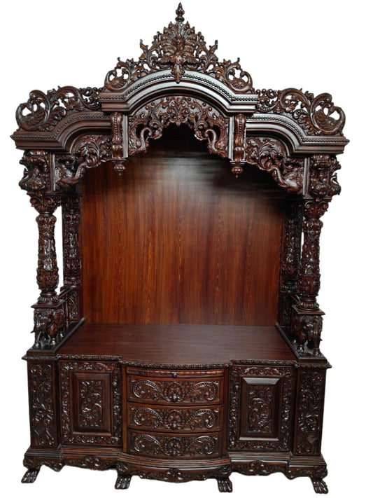 Large wooden pooja mandir with decorative doors and storage drawers