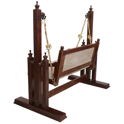 Traditional carved wooden swing with comfortable cushioned seat