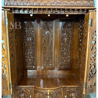 Ornate wooden pooja mandir with traditional temple-style crown